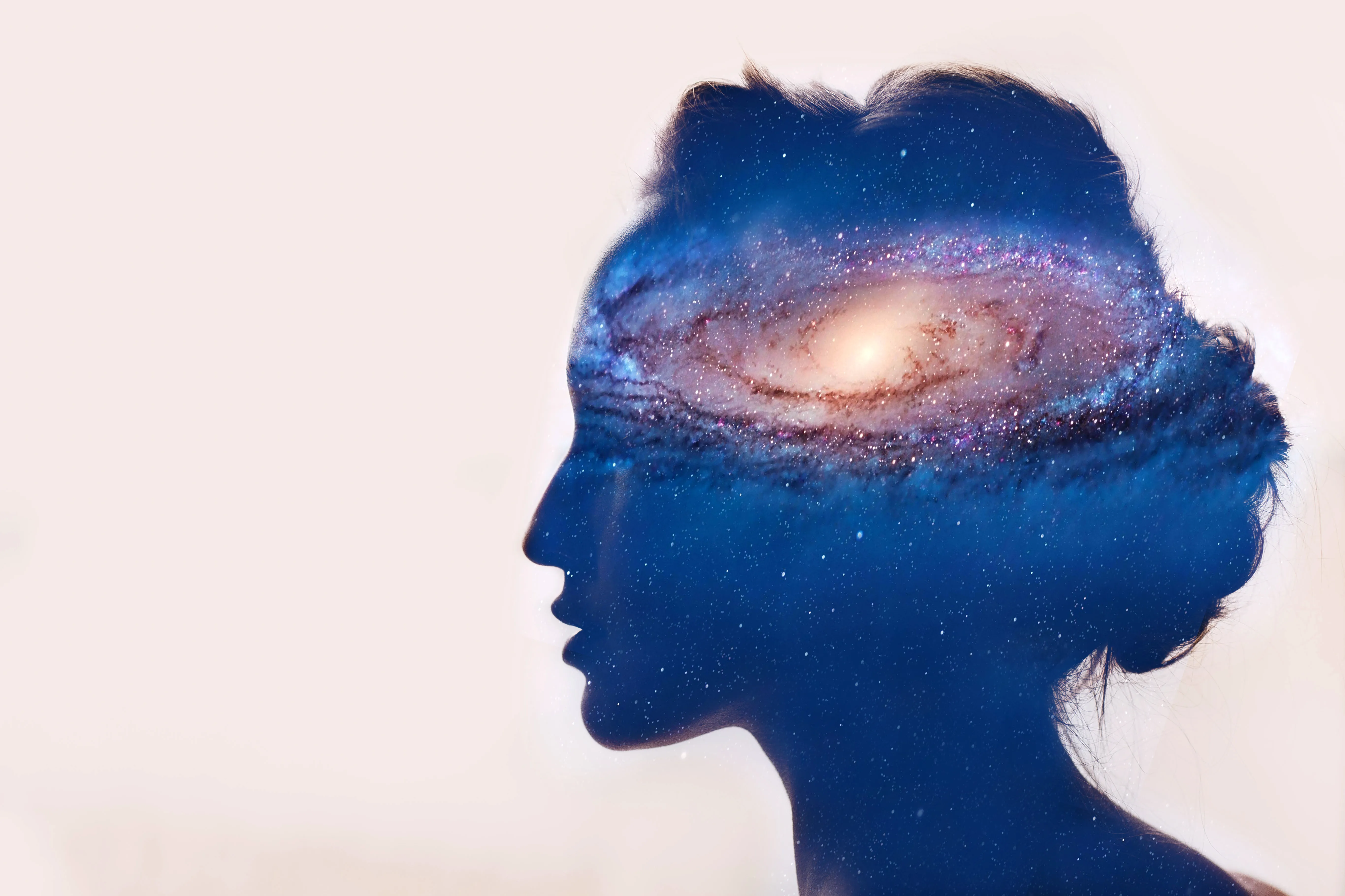Person using smartphone with question marks and astrological symbols representing horoscope app FAQs